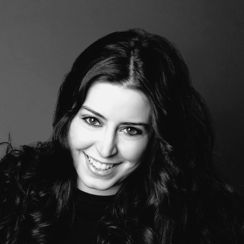 Portrait of Jenna, a professional stylist at Maxine Salon, showcasing their expertise and style.