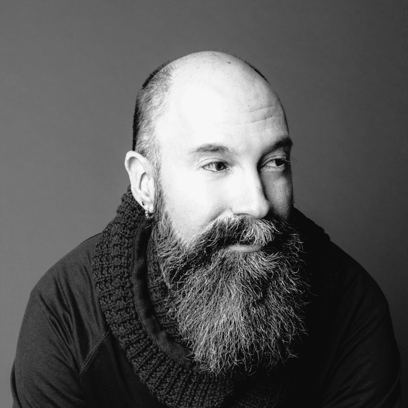 Portrait of Rick, a professional stylist at Maxine Salon, showcasing their expertise and style.