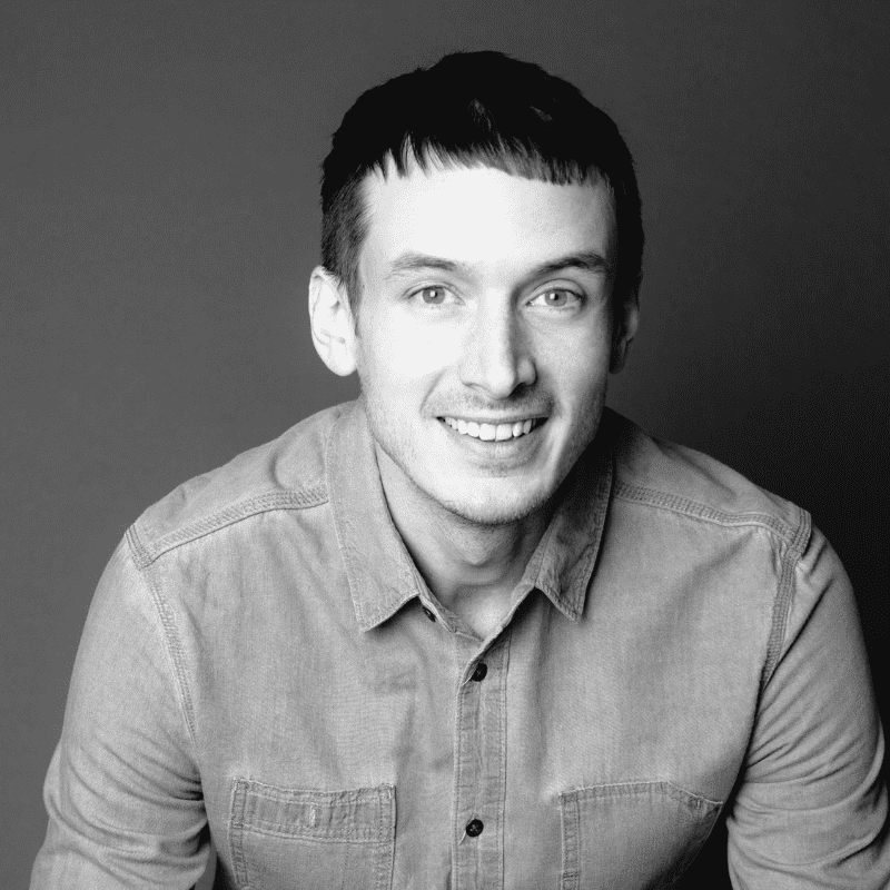 Portrait of Evan, a professional stylist at Maxine Salon, showcasing their expertise and style.