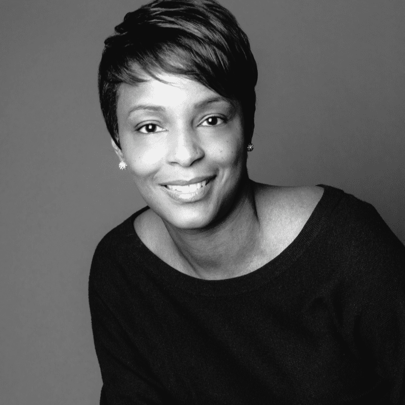 Portrait of Qiana, a professional stylist at Maxine Salon, showcasing their expertise and style.