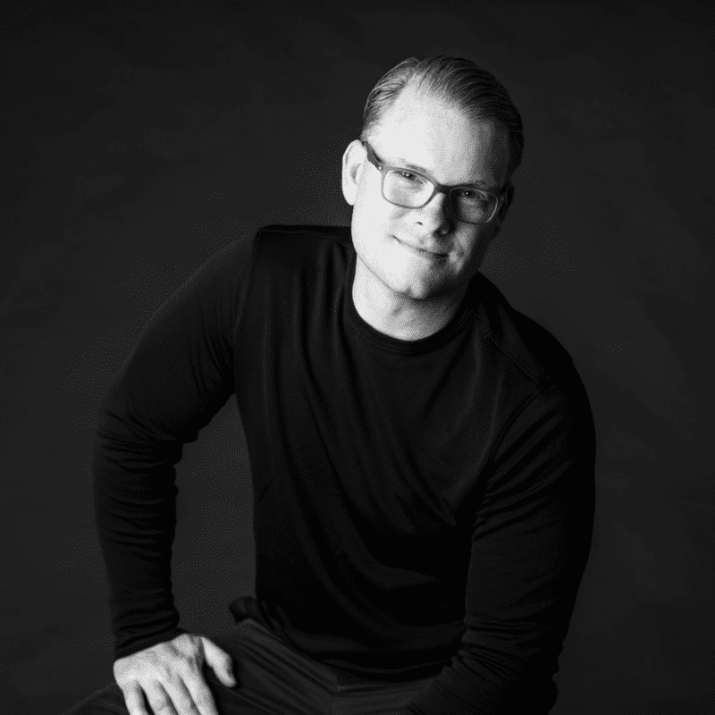 Portrait of Jeremy, a professional stylist at Maxine Salon, showcasing their expertise and style.