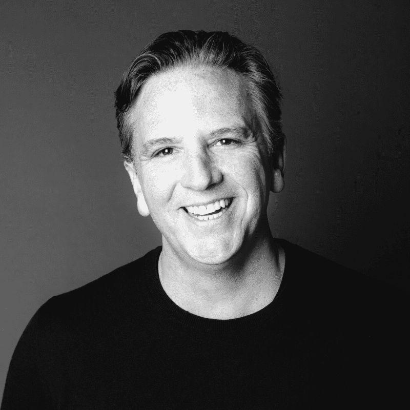 Portrait of Bob, a professional stylist at Maxine Salon, showcasing their expertise and style.