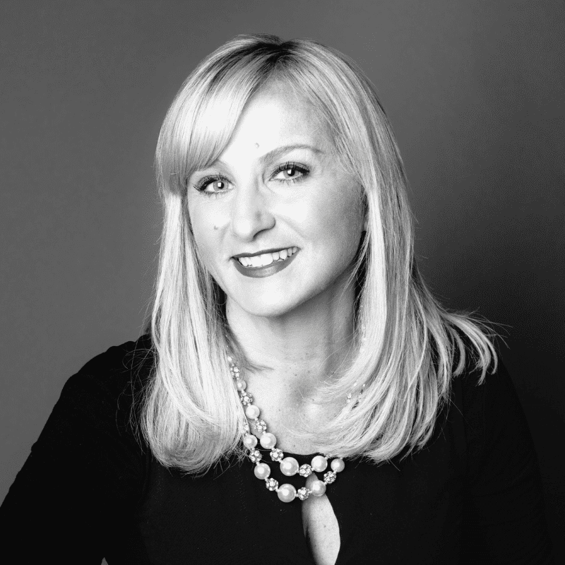 Portrait of Shelly, a professional stylist at Maxine Salon, showcasing their expertise and style.