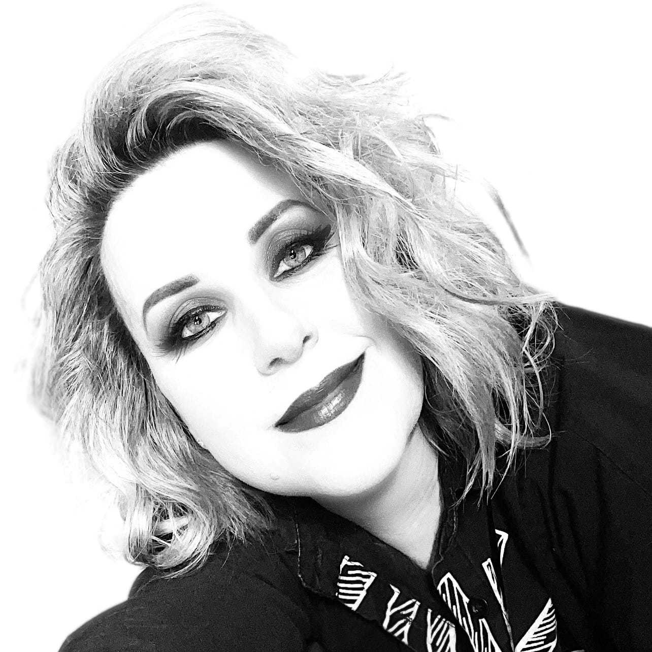 Portrait of Amy, a professional stylist at Maxine Salon, showcasing their expertise and style.