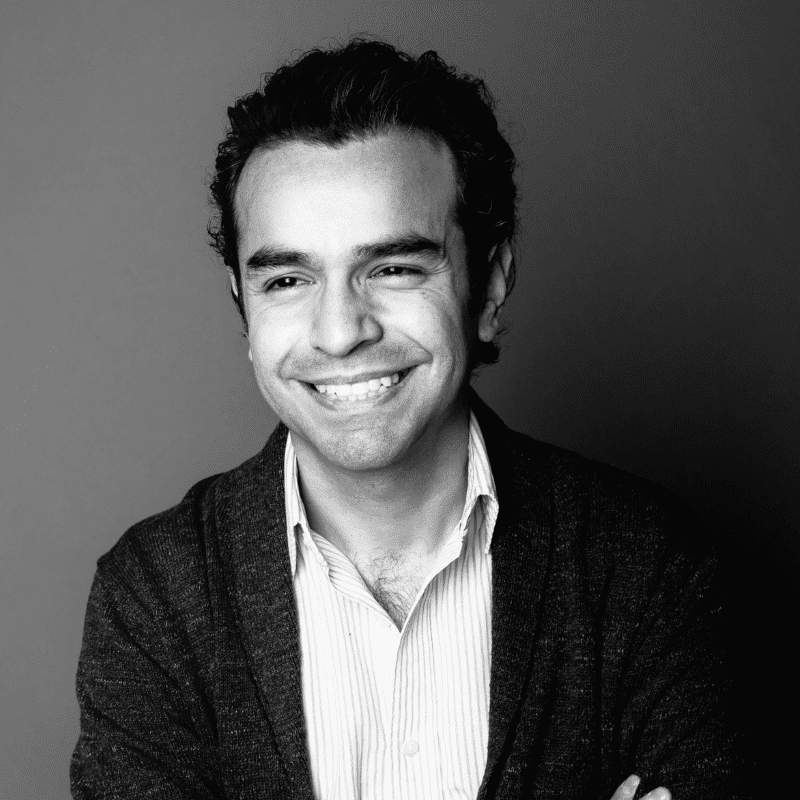 Portrait of Carlos, a professional stylist at Maxine Salon, showcasing their expertise and style.