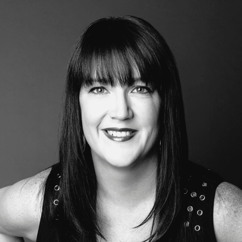 Portrait of Tracey M., a professional stylist at Maxine Salon, showcasing their expertise and style.