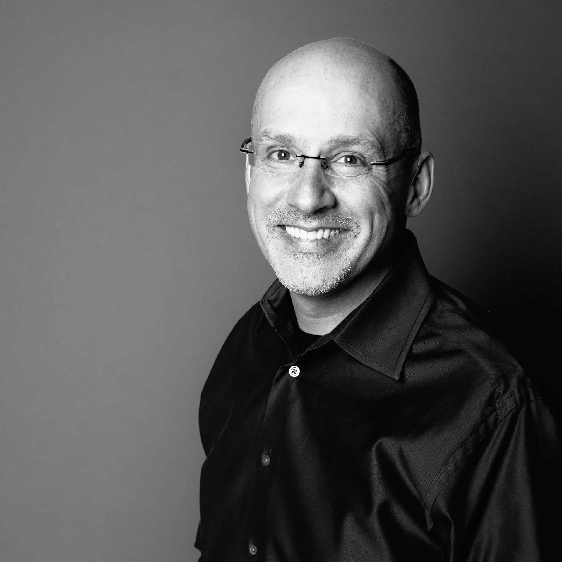Portrait of Robert, a professional stylist at Maxine Salon, showcasing their expertise and style.