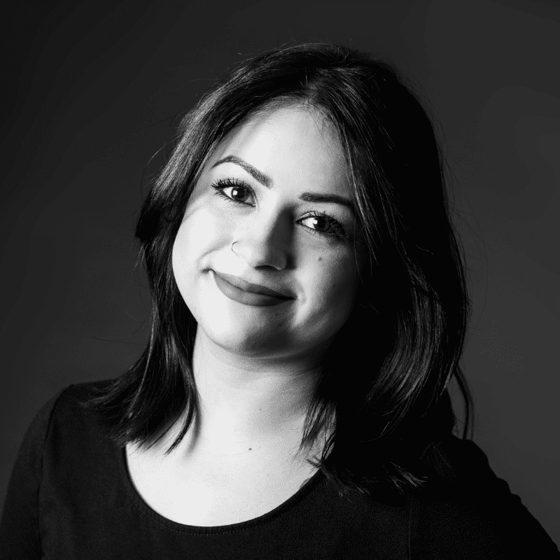 Portrait of Raven, a professional stylist at Maxine Salon, showcasing their expertise and style.