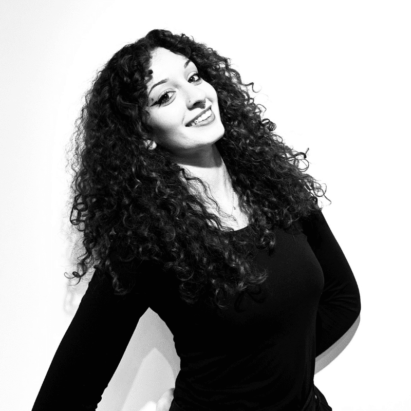 Portrait of Willow, a professional stylist at Maxine Salon, showcasing their expertise and style.