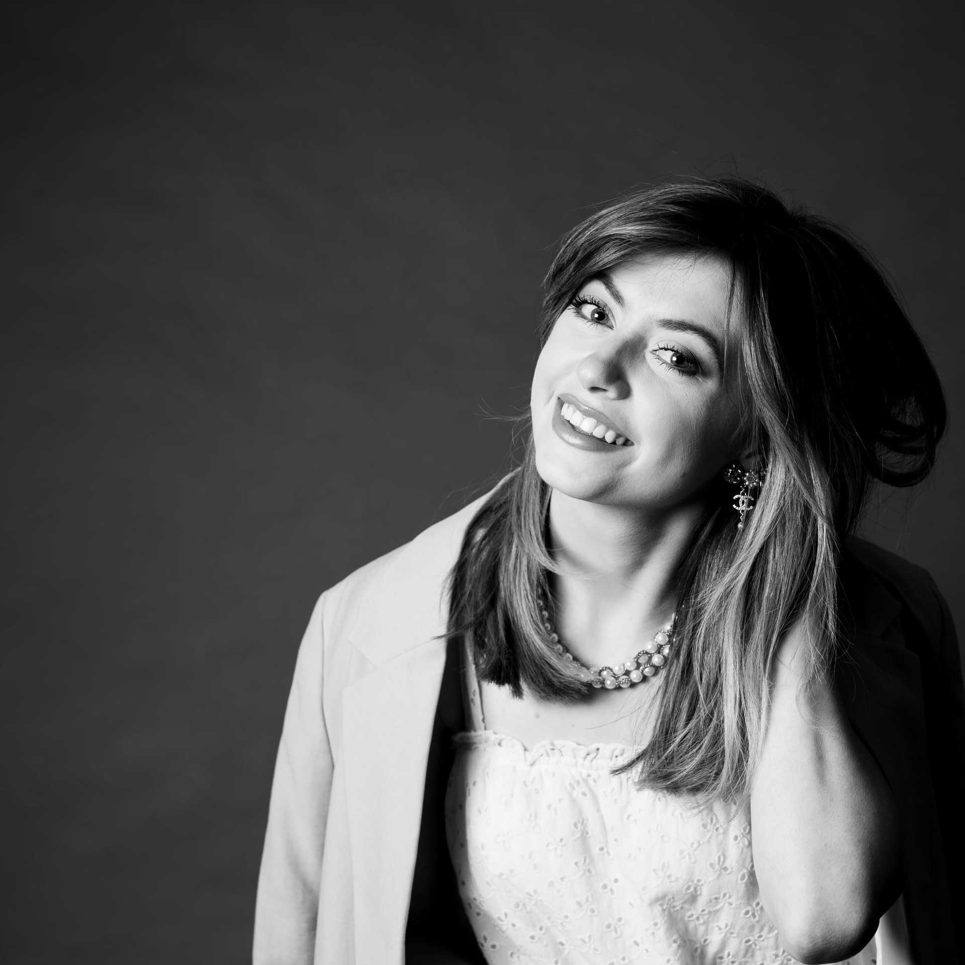 Portrait of Lauren, a professional stylist at Maxine Salon, showcasing their expertise and style.